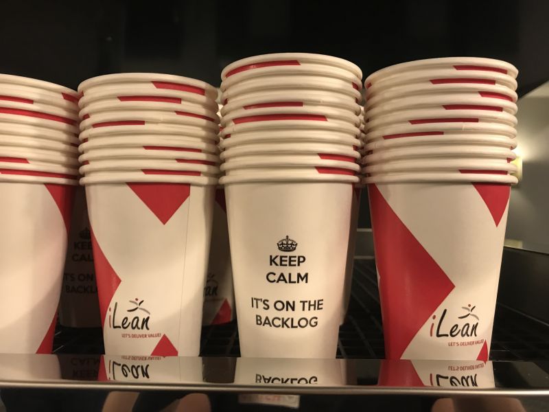 Stacks of paper cups reading: Keep calm, it's on the backlog